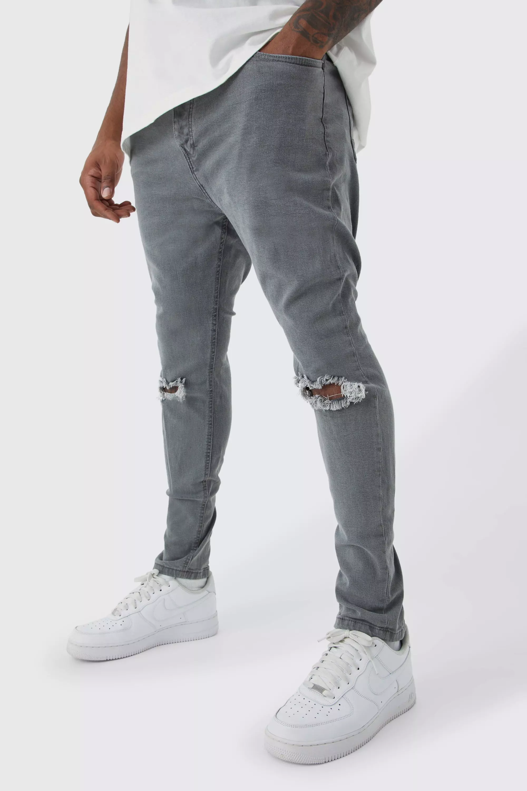 Skinny stretch best sale ripped jeans mens